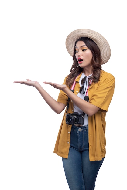 Asian woman with a hat and camera with open palm pointing at something