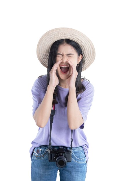 Asian woman with hat and camera yelling something isolated over white background