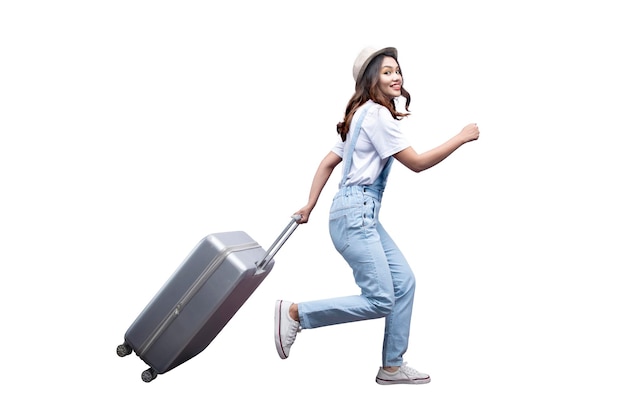 Asian woman with a hat and carrying suitcase