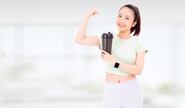 Asian woman with healthy diet protein shake drinking for sport and fitness