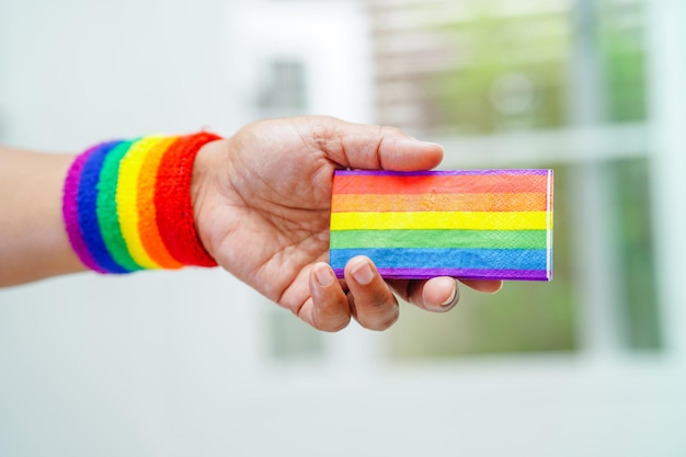 Asian woman with rainbow flag LGBT symbol rights and gender equality LGBT Pride Month in June LGBTQ LGBTI LGBTQA LGBTQIA