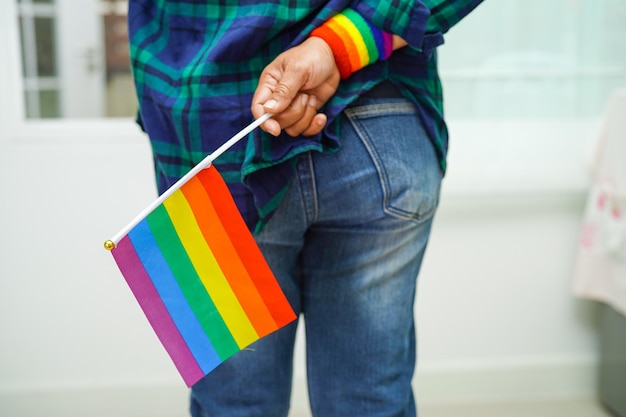 Asian woman with rainbow flag lgbt symbol rights and gender equality lgbt pride month in june