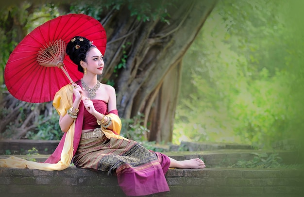 Asian woman with red umbrella