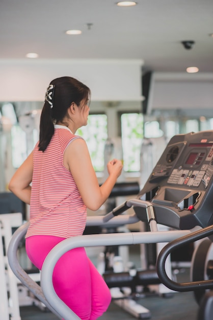 Asian woman work out exercise at gym weight loss