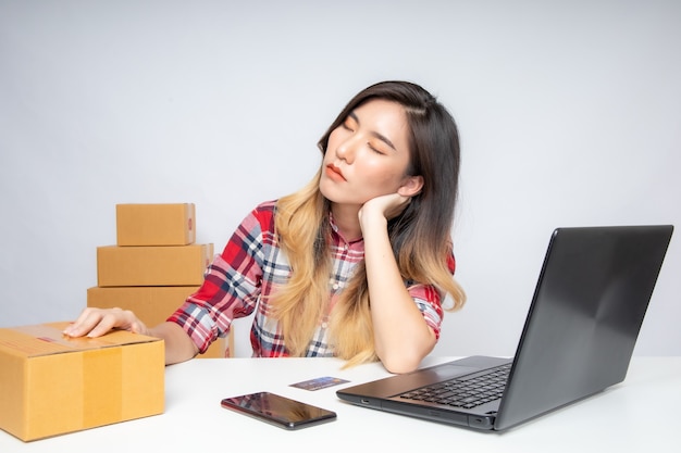 Asian woman working at home for online business