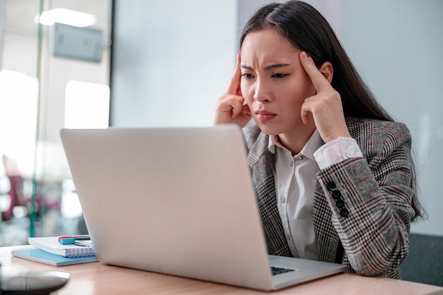 Asian woman working in IT office