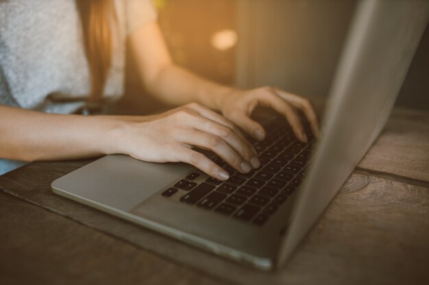 Asian woman working with a laptop computer