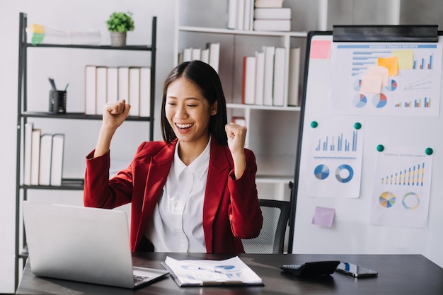 Asian women are stressed while working on laptop Tired asian businesswoman with headache at office feeling sick at work copy space