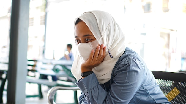 Asian women are tired of waiting at the station