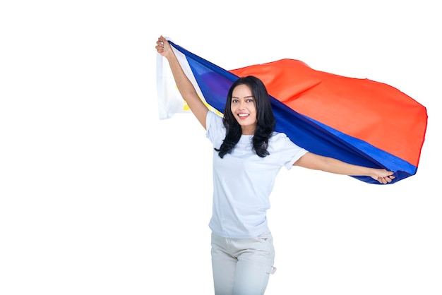 Asian women celebrate the Philippines independence day on 12 June by holding the Philippines flag