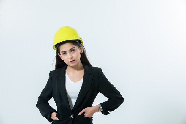 Asian women engineering inspecting and working and holding blueprints on white background