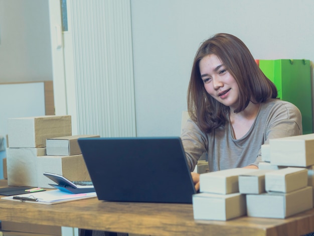 Asian women feel happy with her freelance job