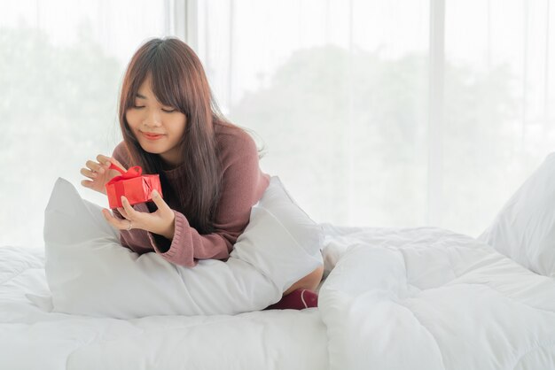 Asian women happy to receive a gift box or present