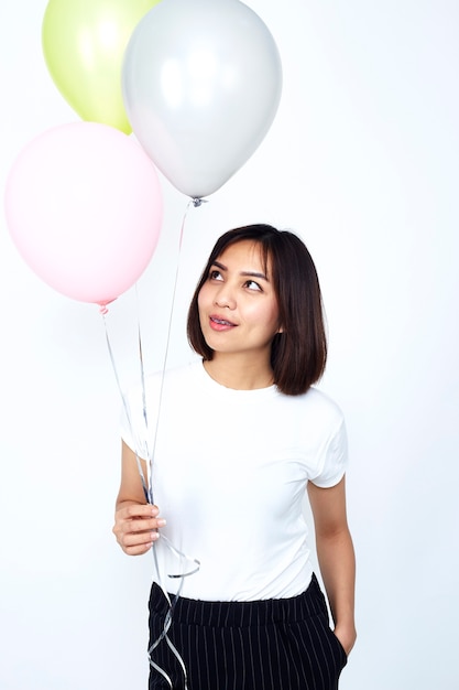 Asian Women holding colorful balloons