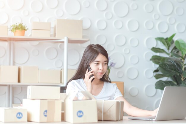 Asian women at the office of the online shopping business in the home office