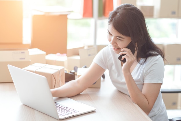 Asian women at the office of the online shopping business in the home office