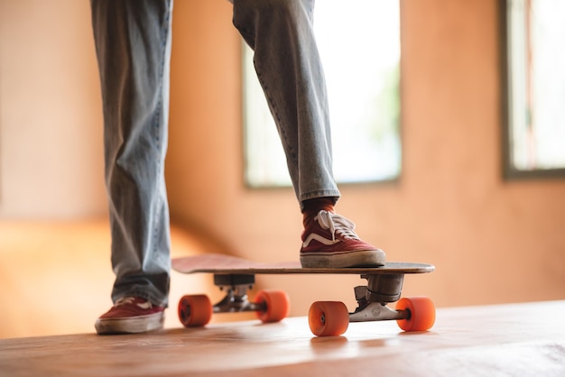 Asian women skater doing tricks jumping in the underground garage Urban activity indoor lifestyle