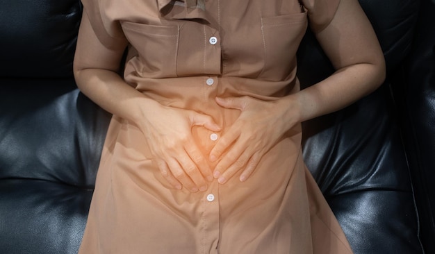 Asian women stomachache hand on stomach
