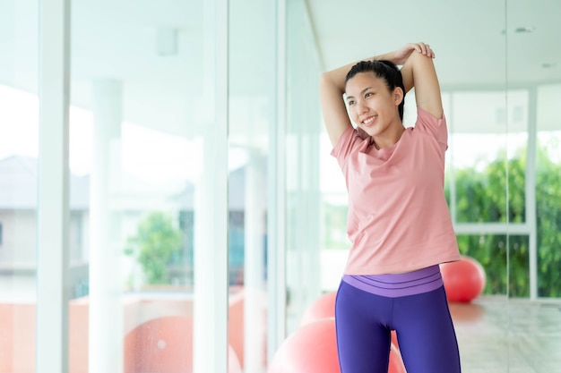 Photo asian women stretching and warm up before exercise