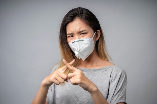 Asian women wear a health mask to prevent the Covid19 virus and dust pm2.5