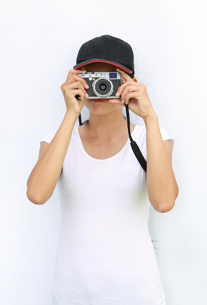 Asian women wear T-Shirt and cap was being photographed on white