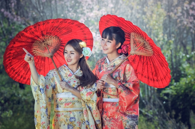 Asian women wearing traditional Japanese kimono