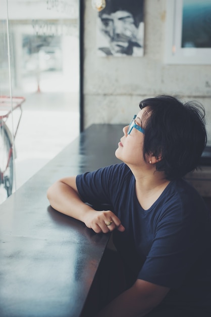 Asian women with eye glasses in coffee shop cafe