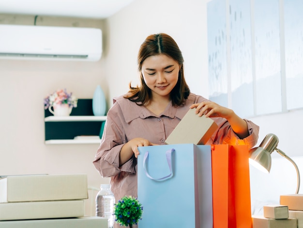 Asian women with her freelance job business online seller.