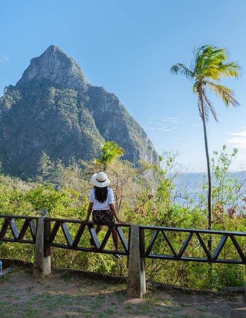 Asian women with a view at the pitons of st lucia saint lucia\
caribbean nature trail in the jungle