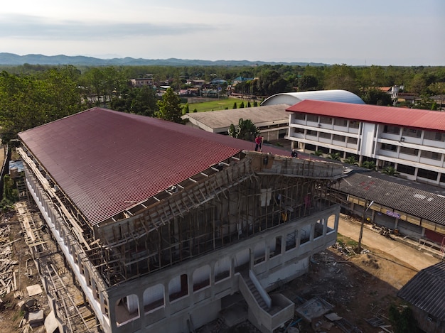 Asian worker building new stadium roof