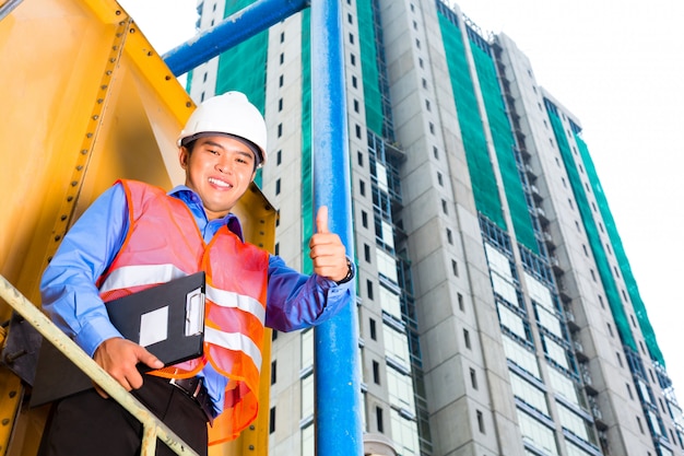 Asian worker or supervisor on building site