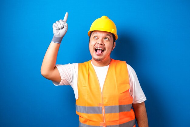 Asian workers wearing helmets are seen looking for ideas in completing work