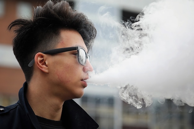 Asian young adult man on street posing at the camera