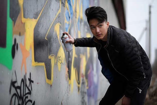 Asian young adult man on street posing at the camera