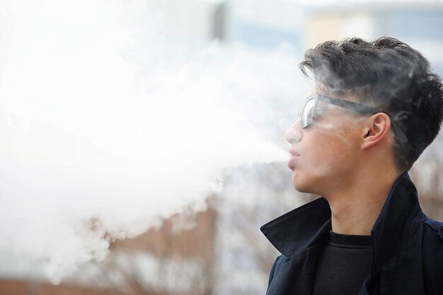 Asian young adult man on street posing at the camera