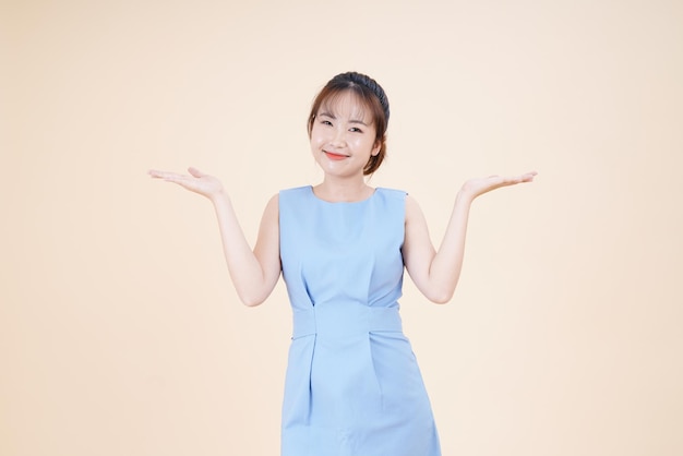 Asian young beautiful woman with hand gesture show the expression of interesting isolated on background