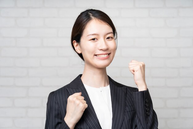 Asian young business woman cheering