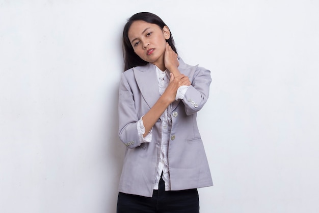 Asian young business woman with sore throat neck and shoulder pain isolated on a white background