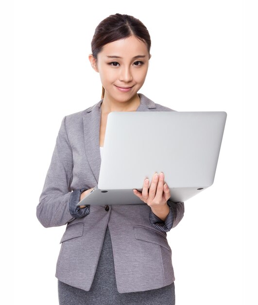 Asian young Businesswoman use of the laptop computer