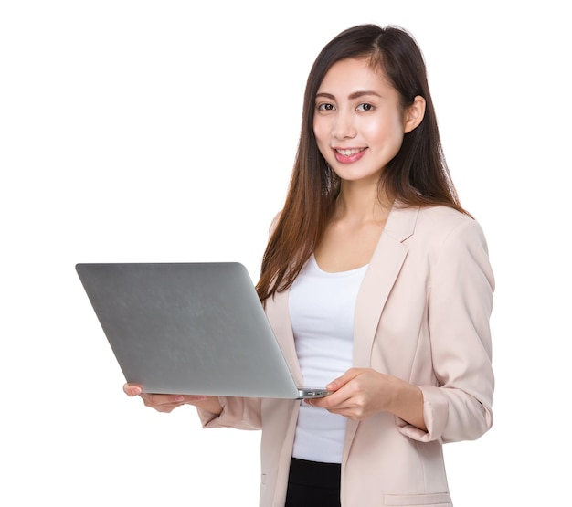 Asian young businesswoman use of the notebook computer