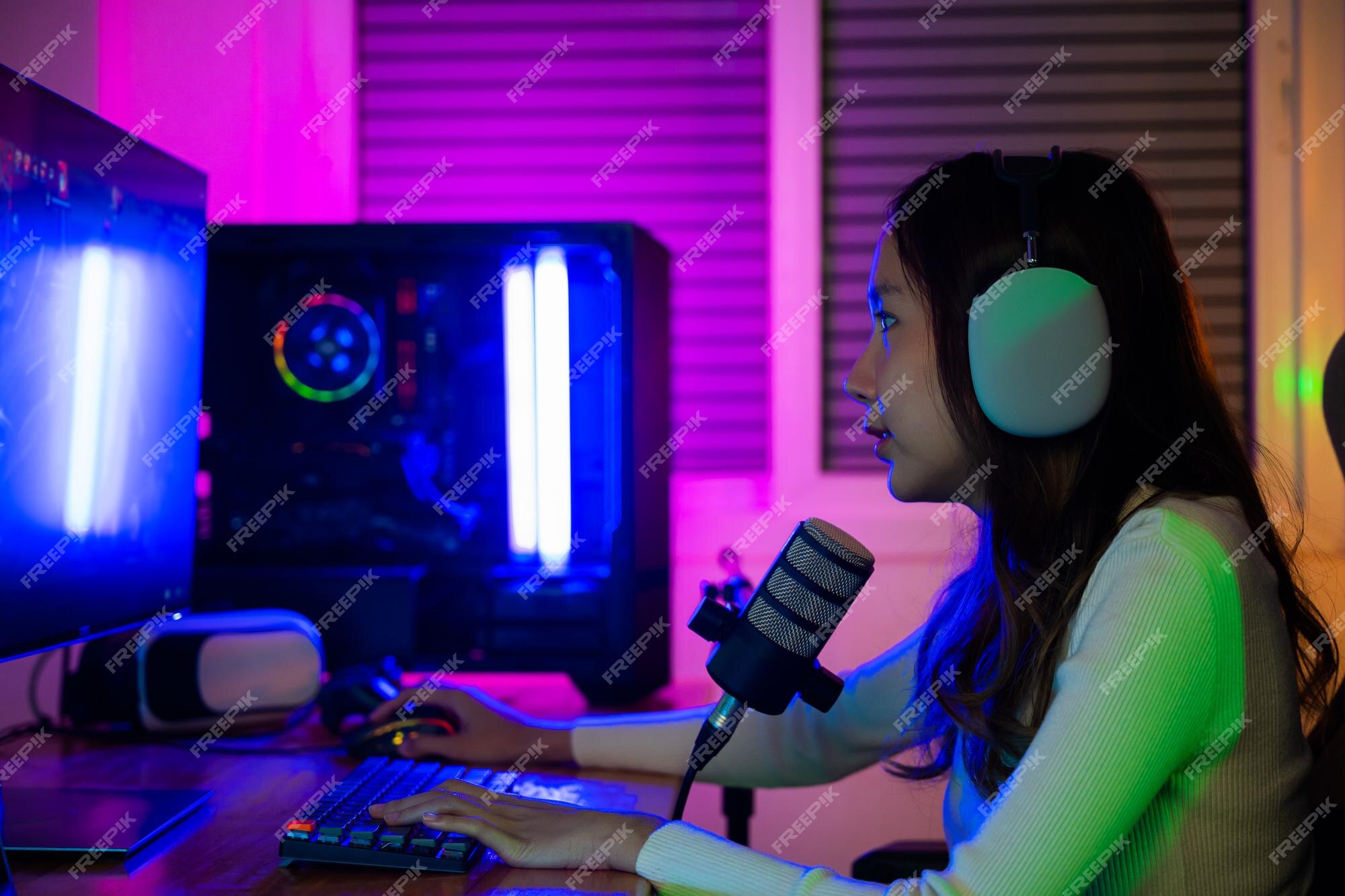 Footage of Young Asian esport woman gamers playing online video games on  the computer with neon light at home. Attractive girl gaming player feels  enjoy technology broadcast live streaming. 25213471 Stock Video