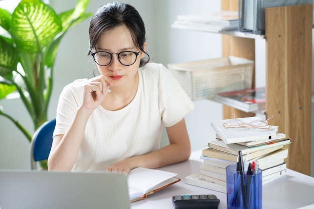 Asian young girl doing homework