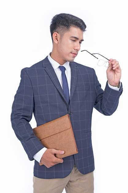 Asian young handsome cheerful business man isolated in white background