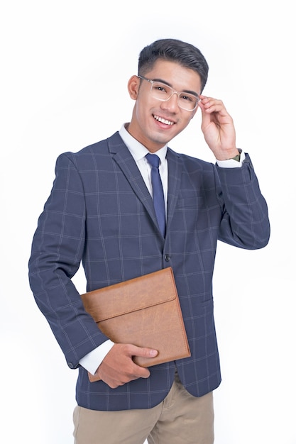 Asian young handsome cheerful business man isolated in white background