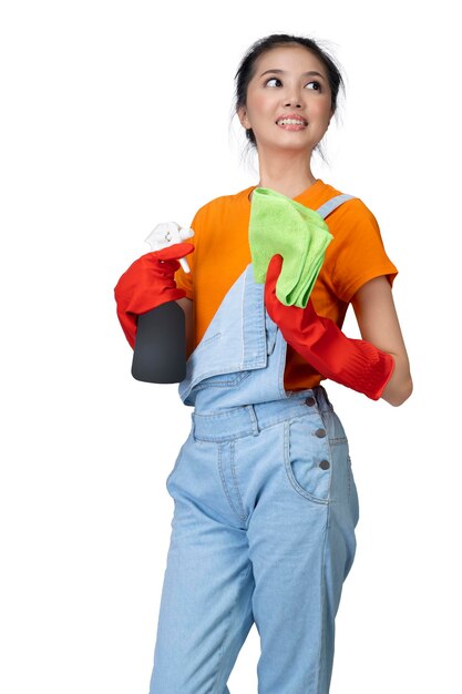 Asian young housewife in protective glove holding bottle sprayer and dry rag