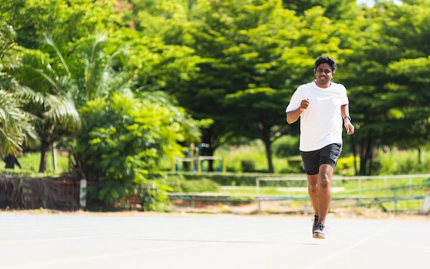 Asian young lifestyle athlete sport runner black man wear feet shoe active running training at the outdoor on the treadmill line road, healthy exercise workout