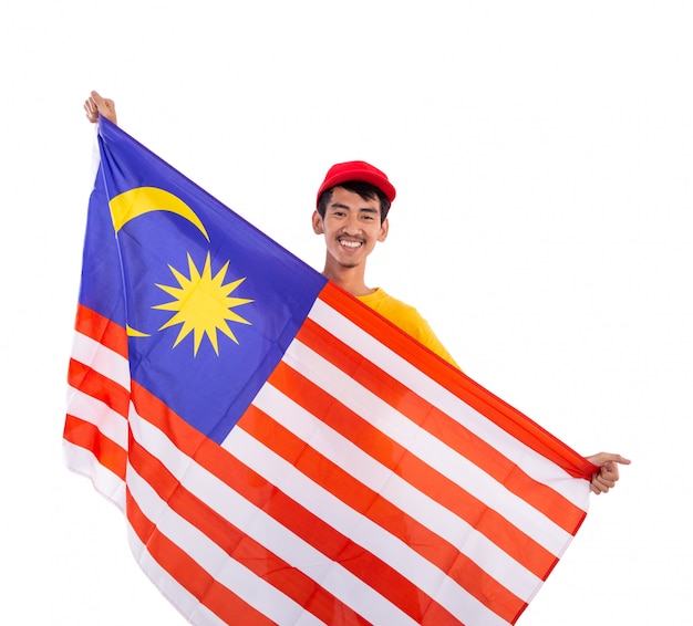 Photo asian young male holding malaysia flag