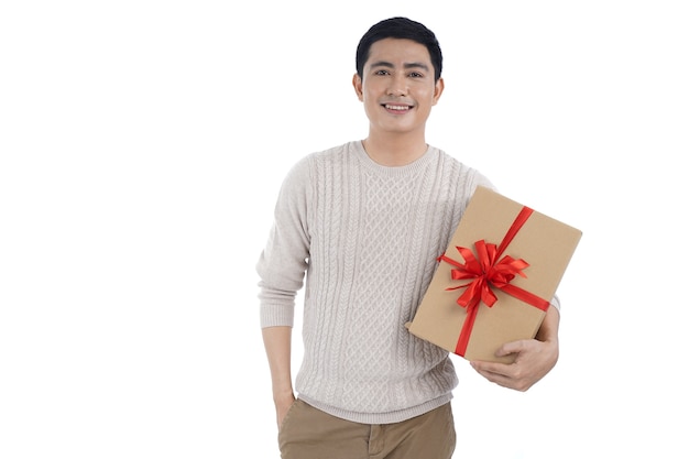 Asian young man holdinging  Christmas gift box with red ribbon