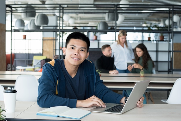 Asian Young Man Posing in Office