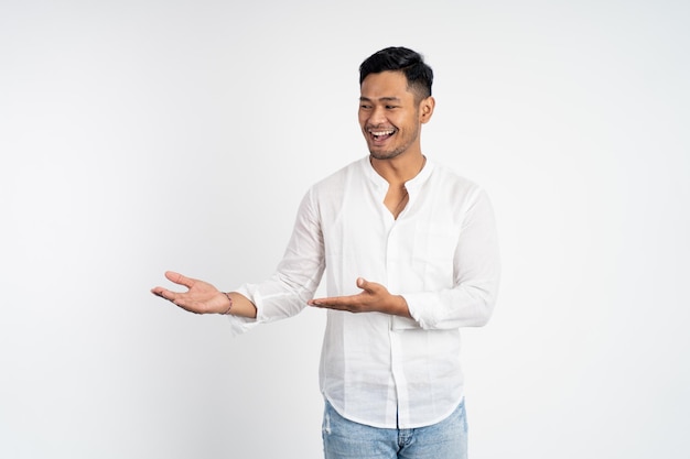 Asian young man with both hands presenting something